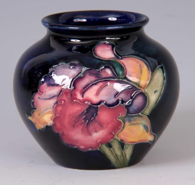 Lot 36 - A MOORCROFT SQUAT BULBOUS VASE decorated in a...