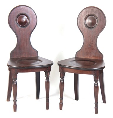 Lot 1048 - A PAIR OF LATE GEORGIAN MAHOGANY HALL CHAIRS...