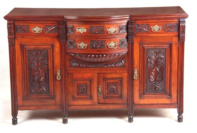 Lot 1067 - A 19TH CENTURY CARVED WALNUT BREAK FRONTED...