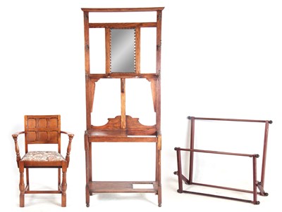 Lot 1072 - A OAK HALLSTAND with mirrored back, coat hooks...