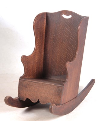 Lot 1115 - AN 18TH CENTURY OAK CHILDS ROCKING CHAIR with...