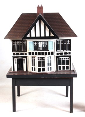 Lot 1131 - A LARGE EDWARDIAN DOLLS HOUSE fully fitted...