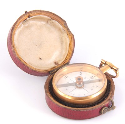 Lot 301 - A LATE 19TH CENTURY GILT METAL COMPASS in...