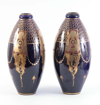 Lot 31 - A PAIR OF BLUE GLASS SLENDER OVOID VASES with...