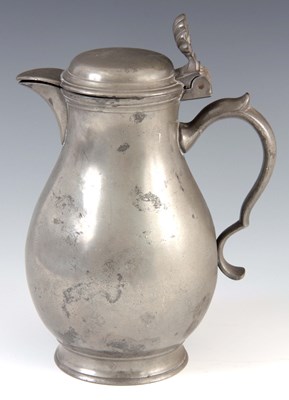 Lot 335 - A 18TH CENTURY PEWTER WATER JUG of bulbous...