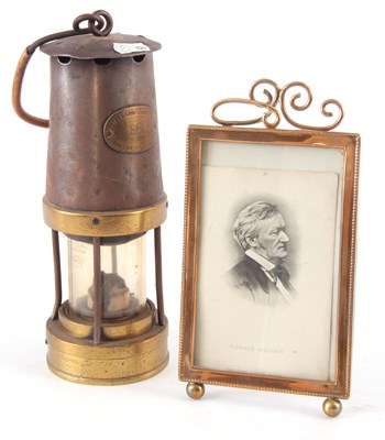 Lot 364 - AN EARLY 20TH CENTURY BRASS STRUT PHOTO FRAME...