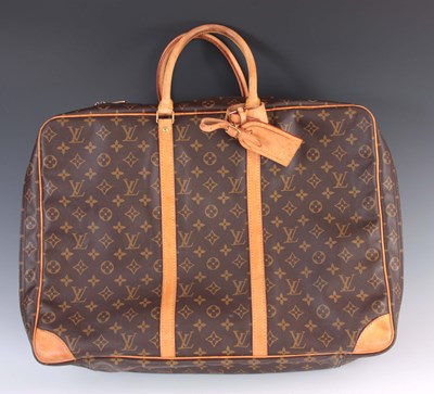 Lot 420 - A LOUIS VUITTON LEATHER MONOGRAMMED TRAVELLING...