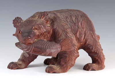 Lot 427 - A CARVED WOOD SCULPTURE formed as a standing...
