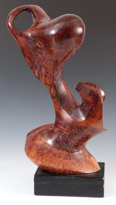 Lot 435 - A CARVED BURR YEWWOOD SCULPTURE mounted on an...