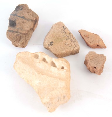 Lot 474 - A PRE-HISTORIC STONE FRAGMENT with carved...