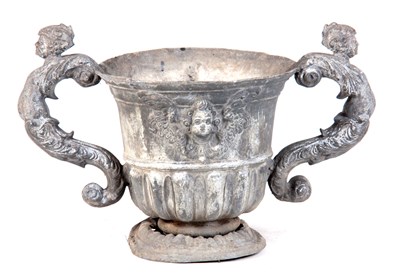 Lot 497 - AN 18TH CENTURY CAST LEAD URN with shaped mask...