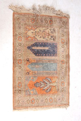 Lot 501 - A TURKISH PRAYER RUG 106cm wide 61cm wide.
