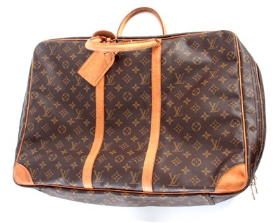 Lot 517 - A LOUIS VUITTON SOFT SUITCASE, with LV...
