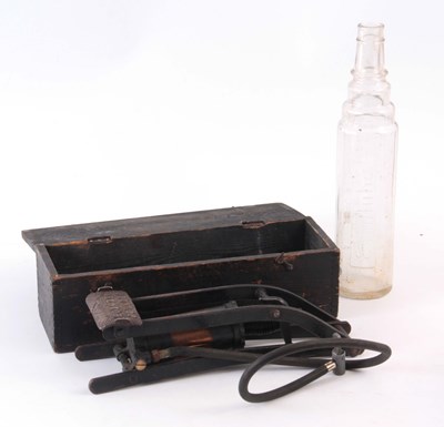 Lot 685 - A DUNLOP FOOT PUMP AND AN ESSOLUBE GLASS BOTTLE