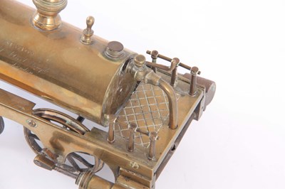 Lot 709 - A BRASS MODEL OF A STEAM ENGINE having been...