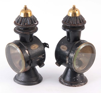 Lot 725 - AN EARLY PAIR OF BLACK AND BRASS WHITE...