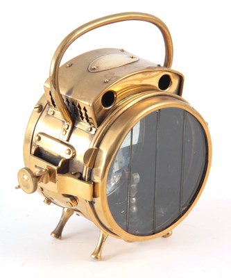Lot 729 - A BRASS POLKEY HEADLAMP with loop handle 22cm...