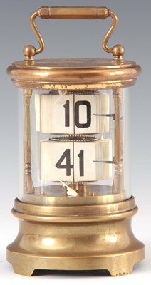 Lot 770 - AN EDWARDIAN BRASS FLIP DIAL CARRIAGE CLOCK of...