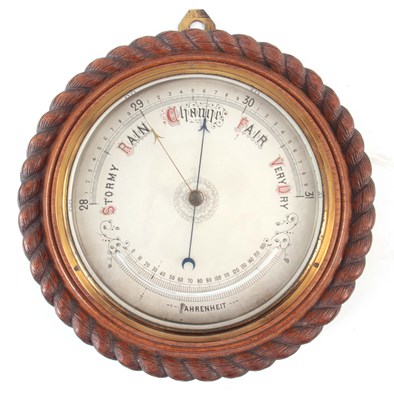 Lot 855 - AN EARLY 20th CENTURY OAK CASED ROPE EDGE...