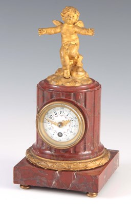 Lot 859 - A FRENCH ROUGE MARBLE AND ORMOLU MANTEL CLOCK...
