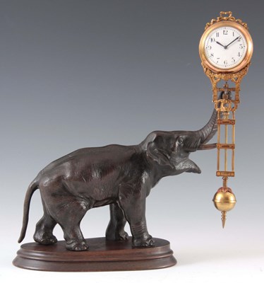 Lot 871 - A FIGURAL MYSTERY CLOCK formed as a patinated...