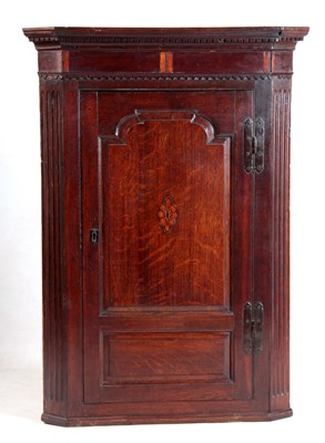Lot 989 - A GEORGE III OAK HANGING CORNER CUPBOARD with...